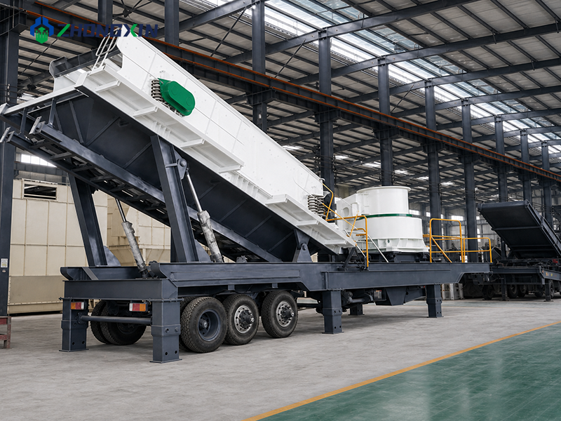 Montaje del chasis reforzado de remolque sobre ruedas para planta móvil de fabricación de arena en la nave industrial